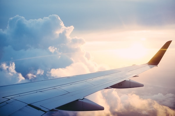 Air plane wing from the view of a passenger in the air.